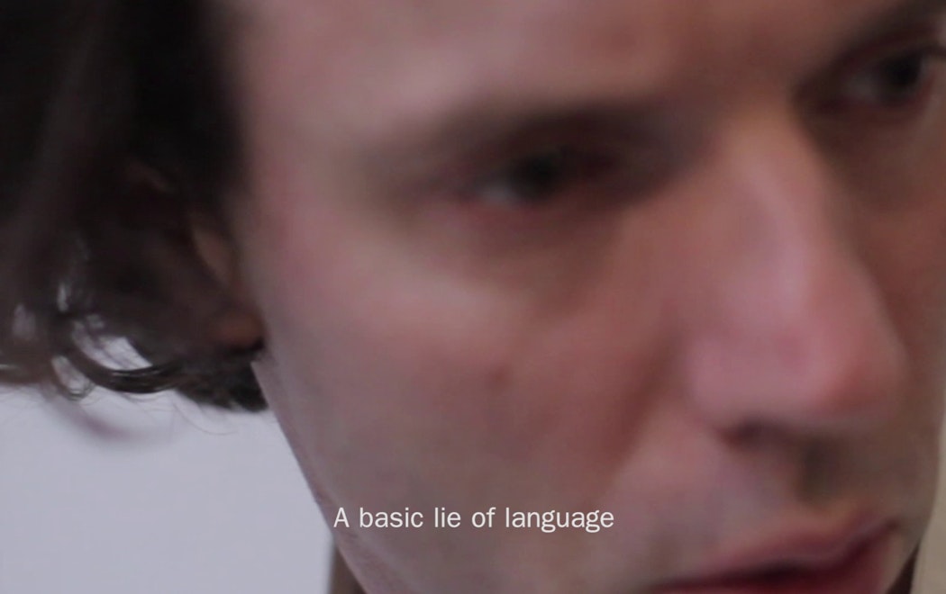 A close up of a face with text "A basic lie of language"